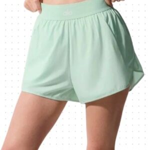 NWT Alo Match Point shorts in size Medium. Color: Spearmint